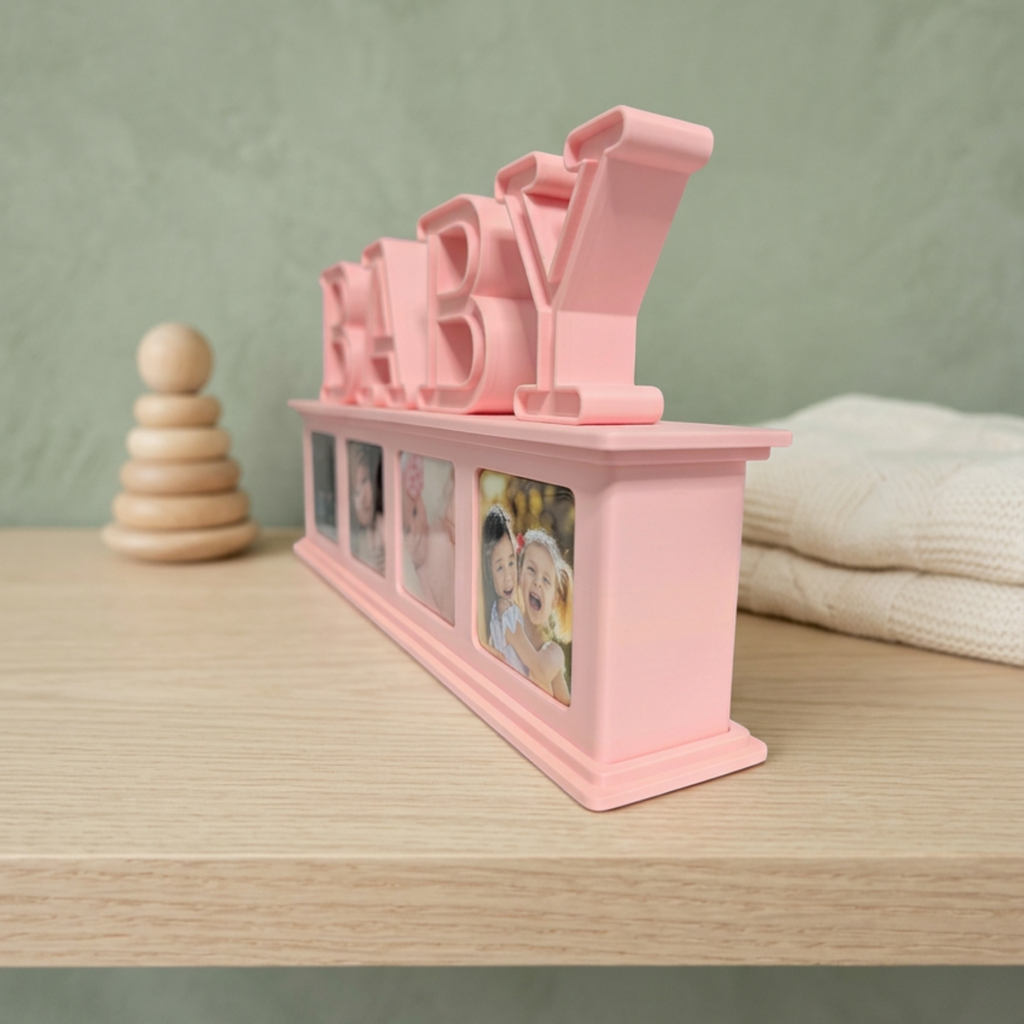 Side-angle view of a pink BABY photo magnet display with four photo magnets on a light wood shelf against a sage green background.