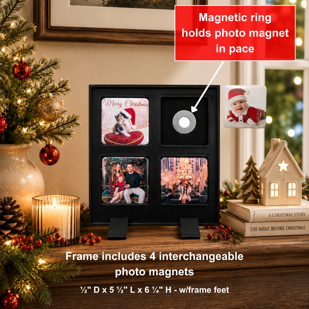 A black magnetic photo frame with four slots displaying family and pet photo magnets, shown on a tabletop in a living room setting. The image includes text callouts explaining the magnetic ring and interchangeable photo magnets, with decorative flowers, books, and a candle around it.
