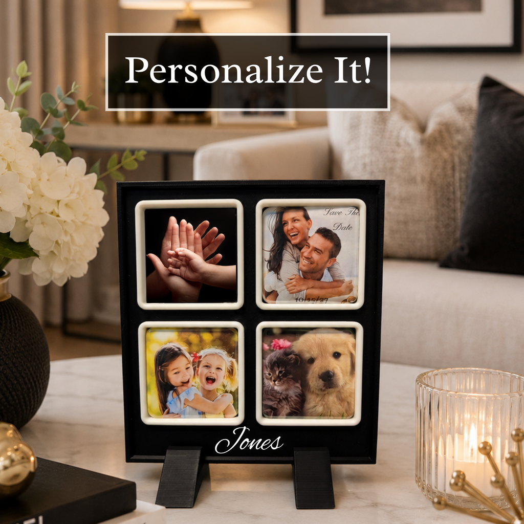 A black four-photo frame with white borders stands on a tabletop in a living room setting. The photos shown are sample images, including hands, a couple embracing, children smiling, and a dog.