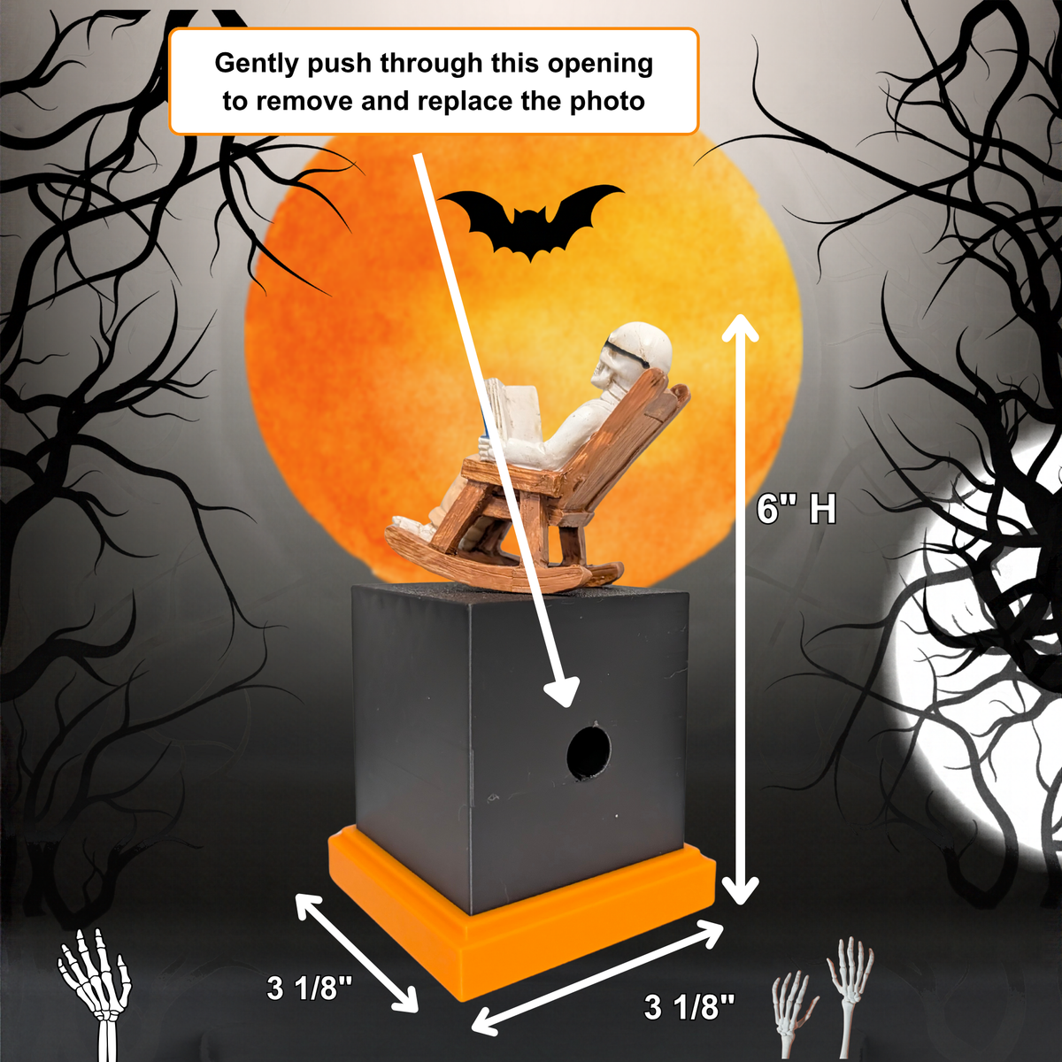 Halloween memory cube photo display with a black cube, orange base, rocking chair figure, and large orange moon backdrop, shown with measurement arrows and text instructions for removing and replacing the photo.