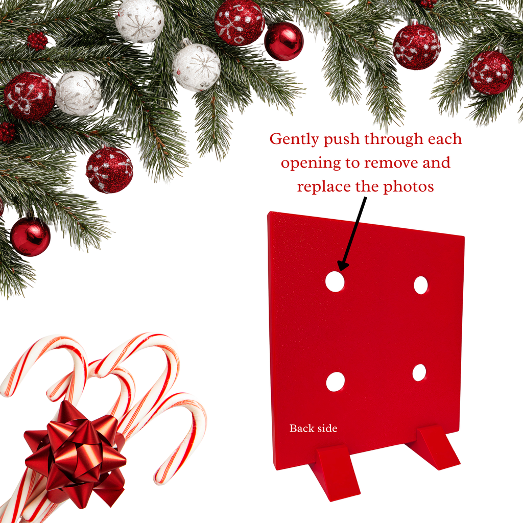 A red holiday photo frame or display board with circular cutouts, shown on a white background with Christmas tree branches, ornaments, candy canes, and a bow. Text reads 'Gently push through each opening to remove and replace the photos' and 'Back side'.