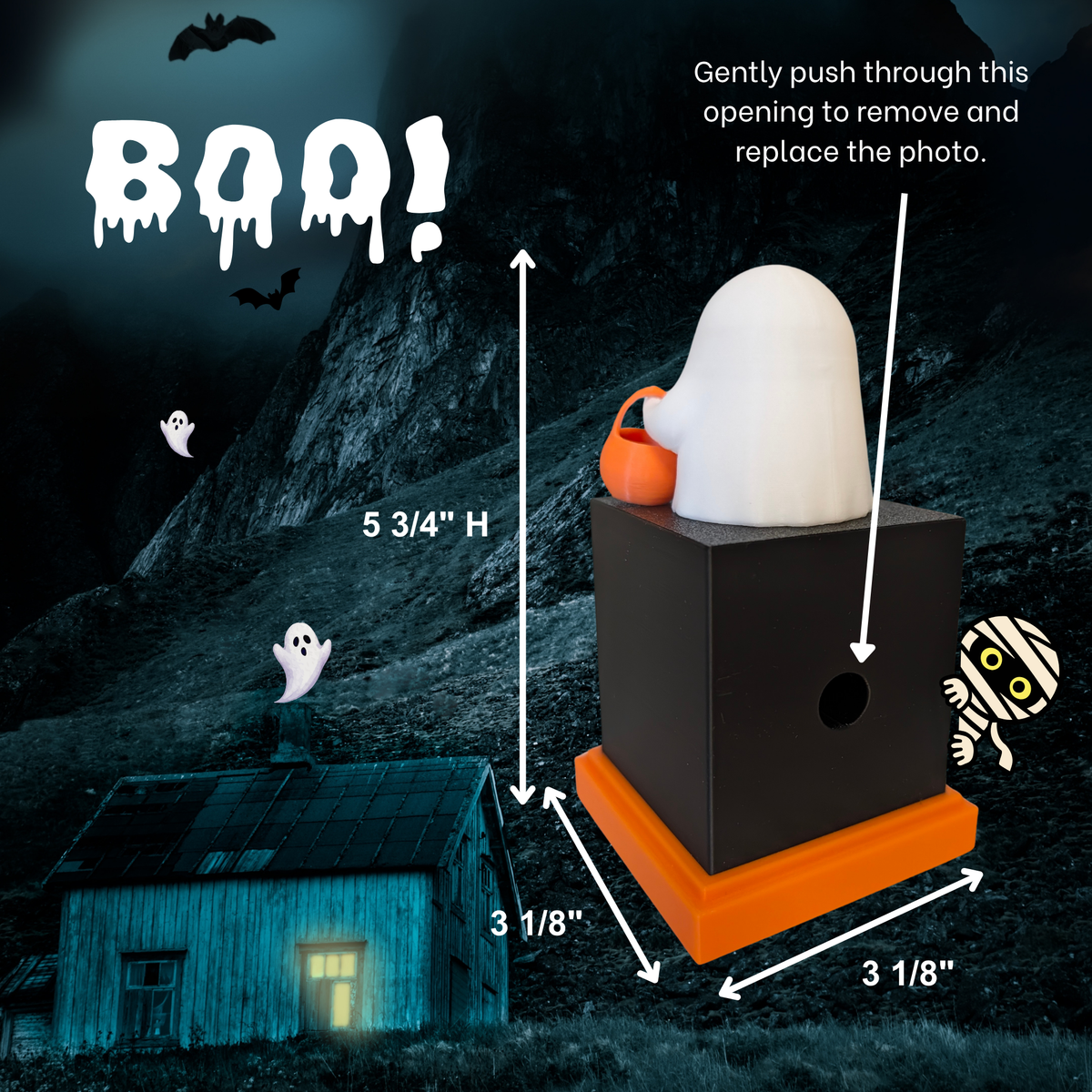 Halloween memory cube photo display with a black cube, orange base, white ghost decoration, and small orange pumpkin, shown with dimension arrows and a spooky mountain background with text reading 'BOO!' and product measurements.